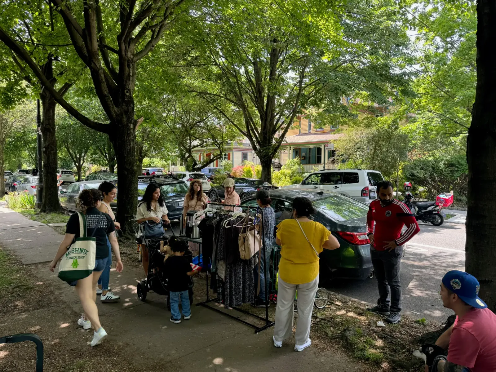 Neighbors browsing a sidewalk sale during the DPWNA tag sale